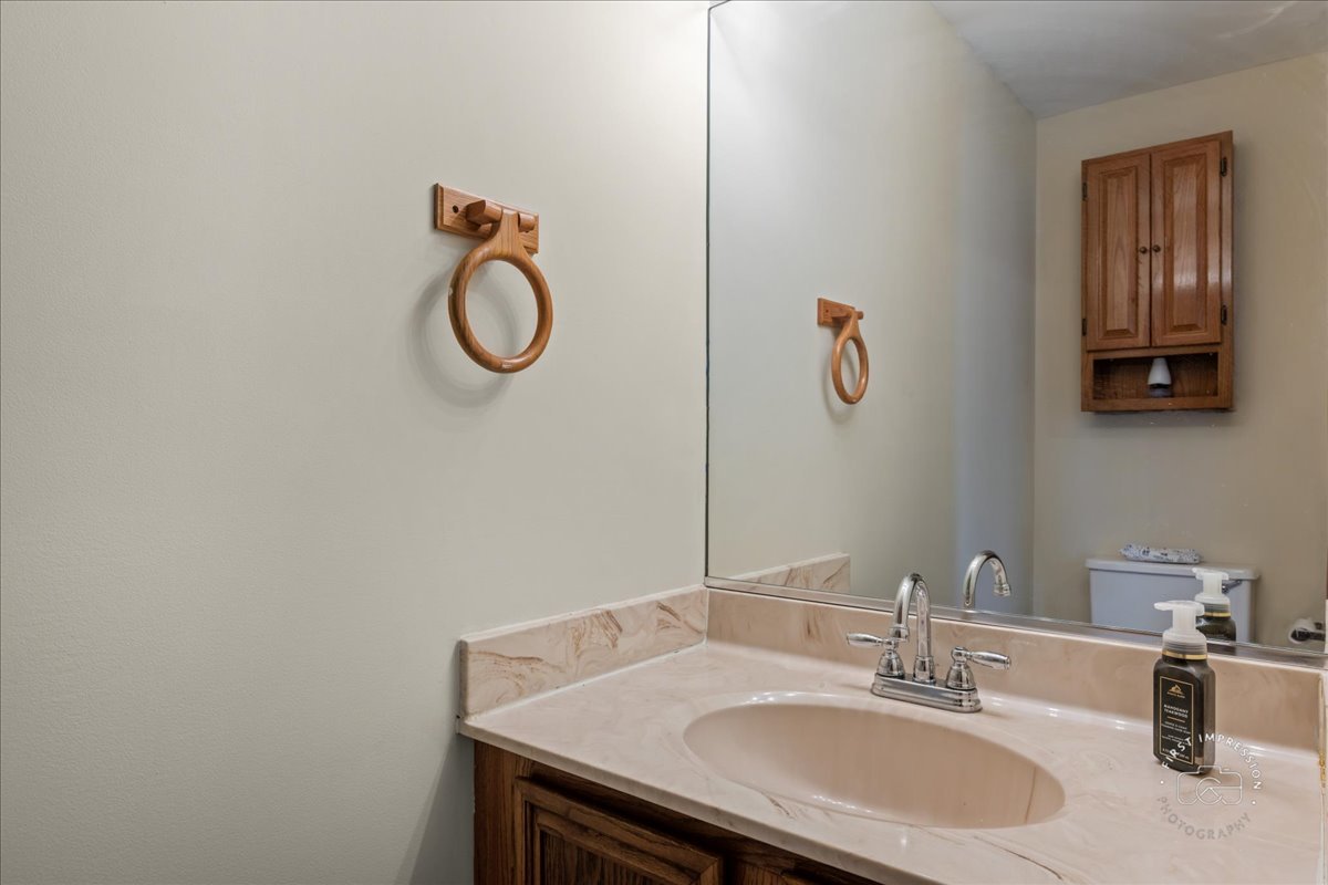 362 Chaparral Court Elgin, IL 60120 - Photo 7 of 15 a bathroom with a granite countertop sink and a mirror