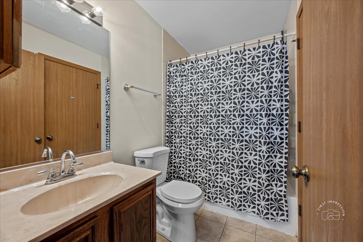 362 Chaparral Court Elgin, IL 60120 - Photo 8 of 15 a bathroom with a sink toilet and shower