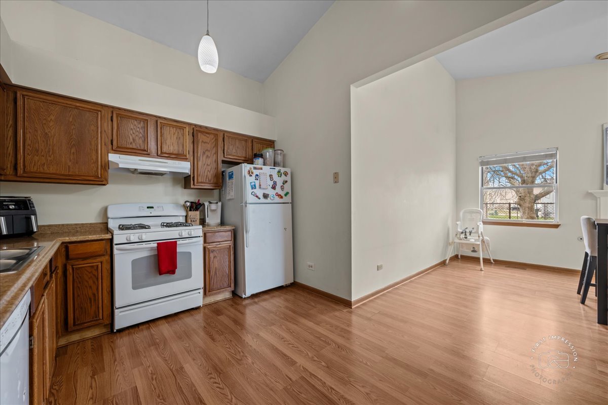 362 Chaparral Court Elgin, IL 60120 - Photo 10 of 15 a kitchen with stainless steel appliances a stove a sink and a refrigerator