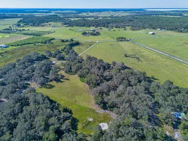 an aerial view of a houses with a outdoor space