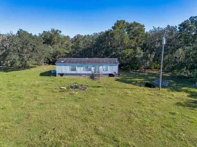 a view of a pool with a yard