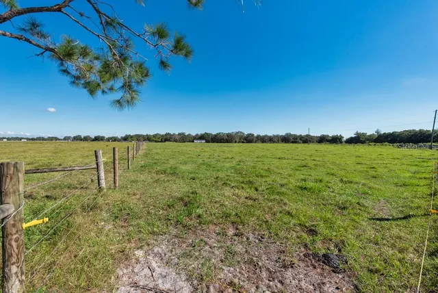 a view of a lake with houses in the back