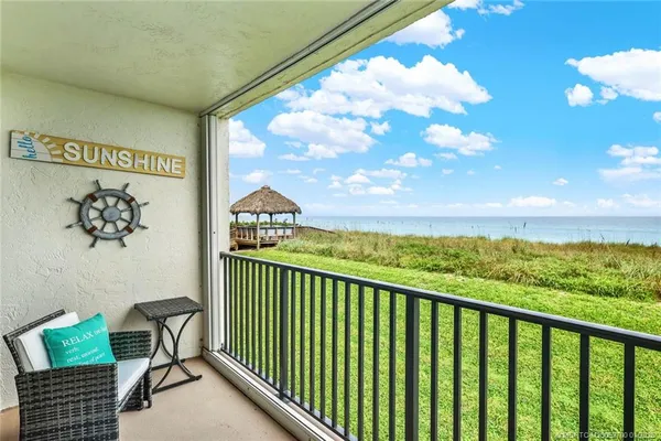 a view of balcony with furniture
