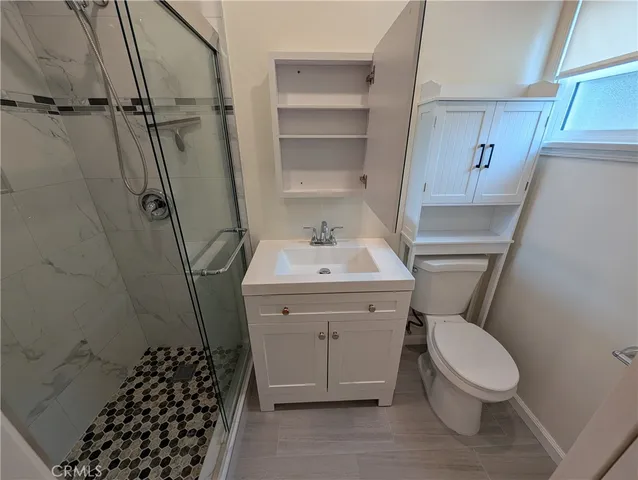 a kitchen with stainless steel appliances granite countertop a sink and a stove