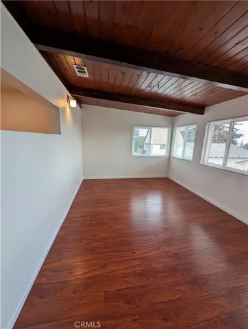 a backyard of a house with lots of green space and plants