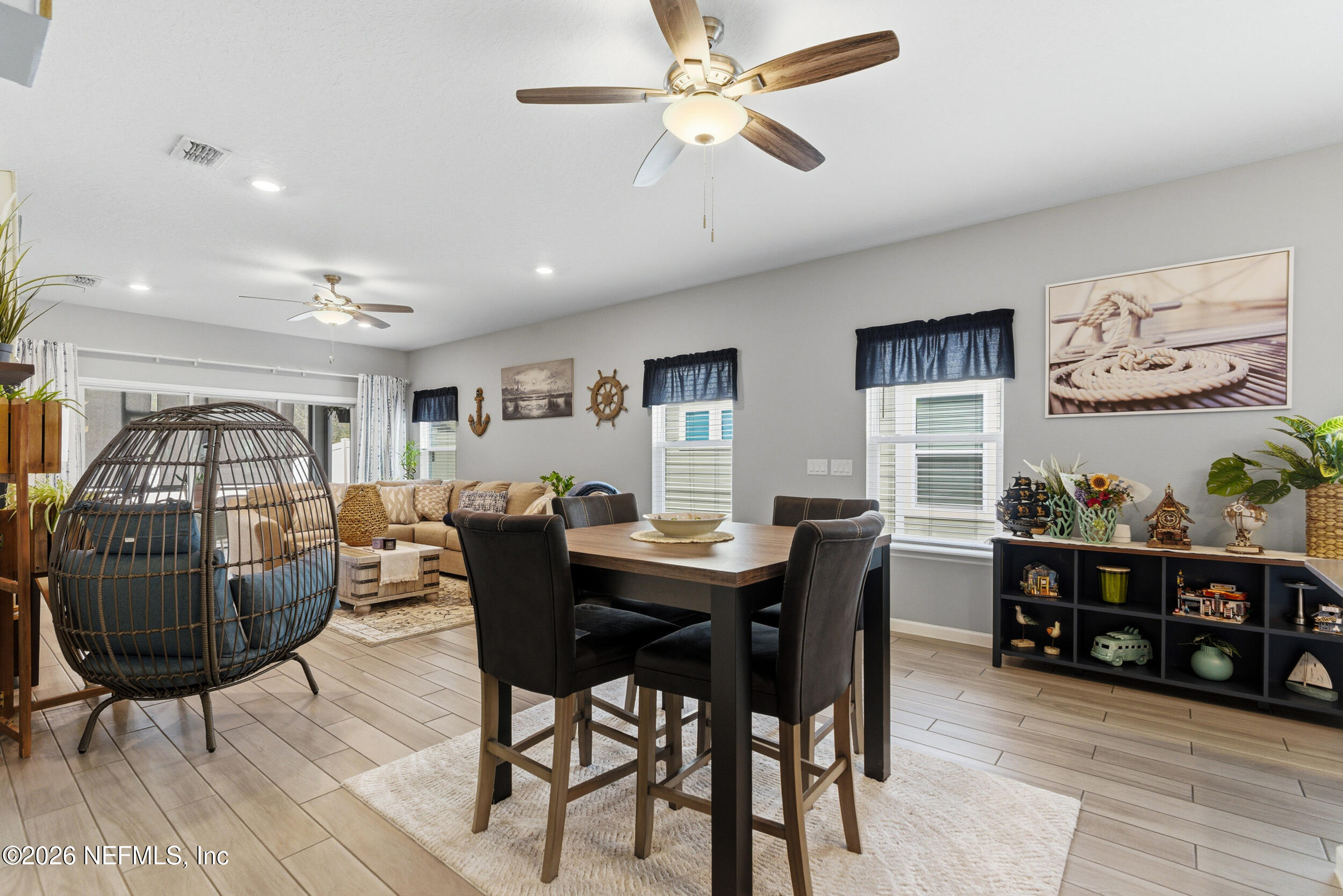 6507 Longleaf Branch Drive Jacksonville, FL 32222 - Photo 12 of 34 a view of a dining room with furniture and wooden floor