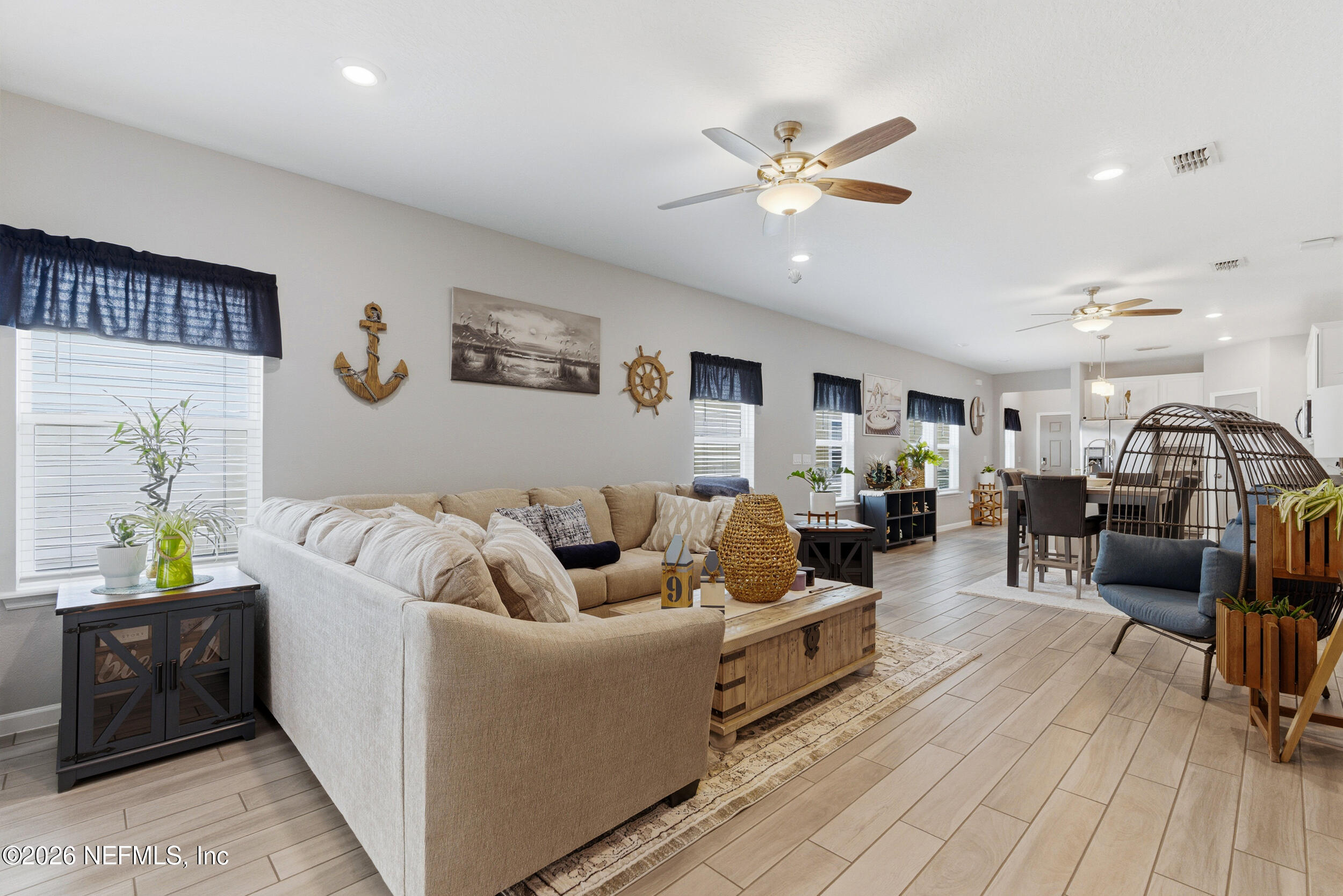 6507 Longleaf Branch Drive Jacksonville, FL 32222 - Photo 14 of 34 a living room with furniture and kitchen view