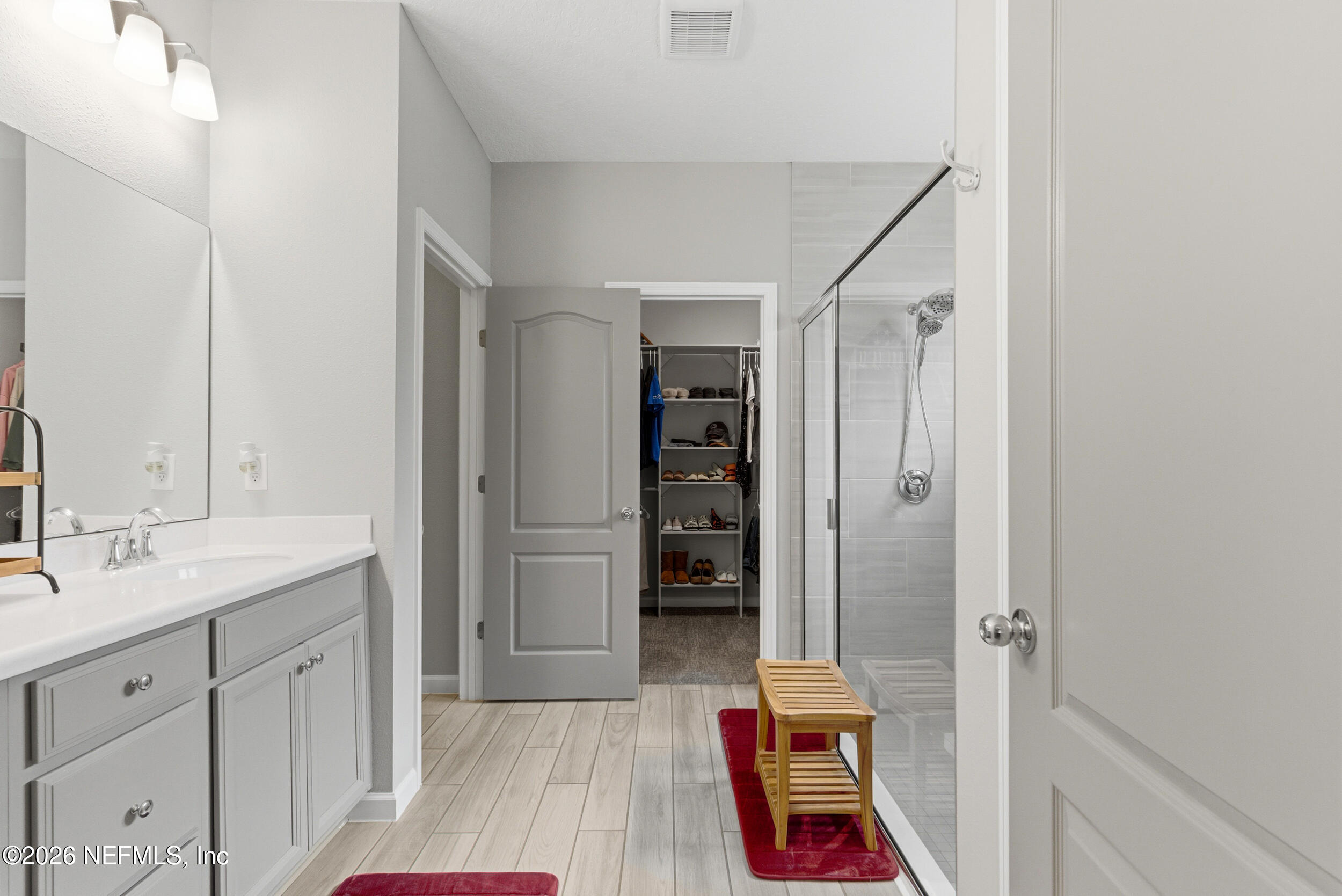 6507 Longleaf Branch Drive Jacksonville, FL 32222 - Photo 21 of 34 a room with a bed and a mirror