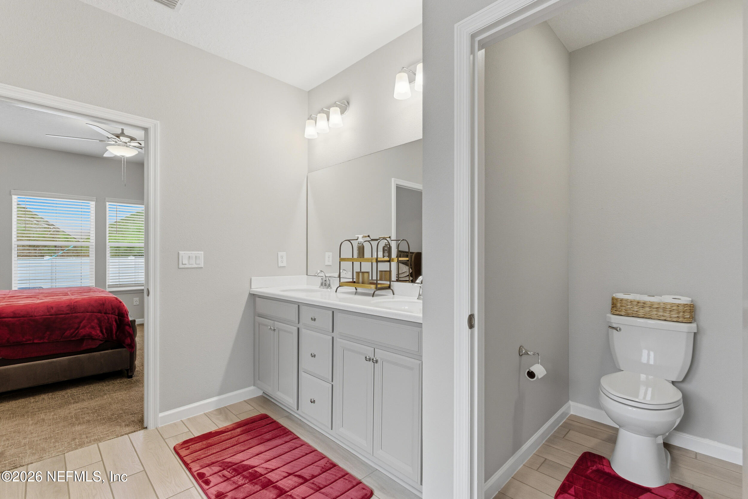 6507 Longleaf Branch Drive Jacksonville, FL 32222 - Photo 24 of 34 a en suite bathroom with a sink and a mirror