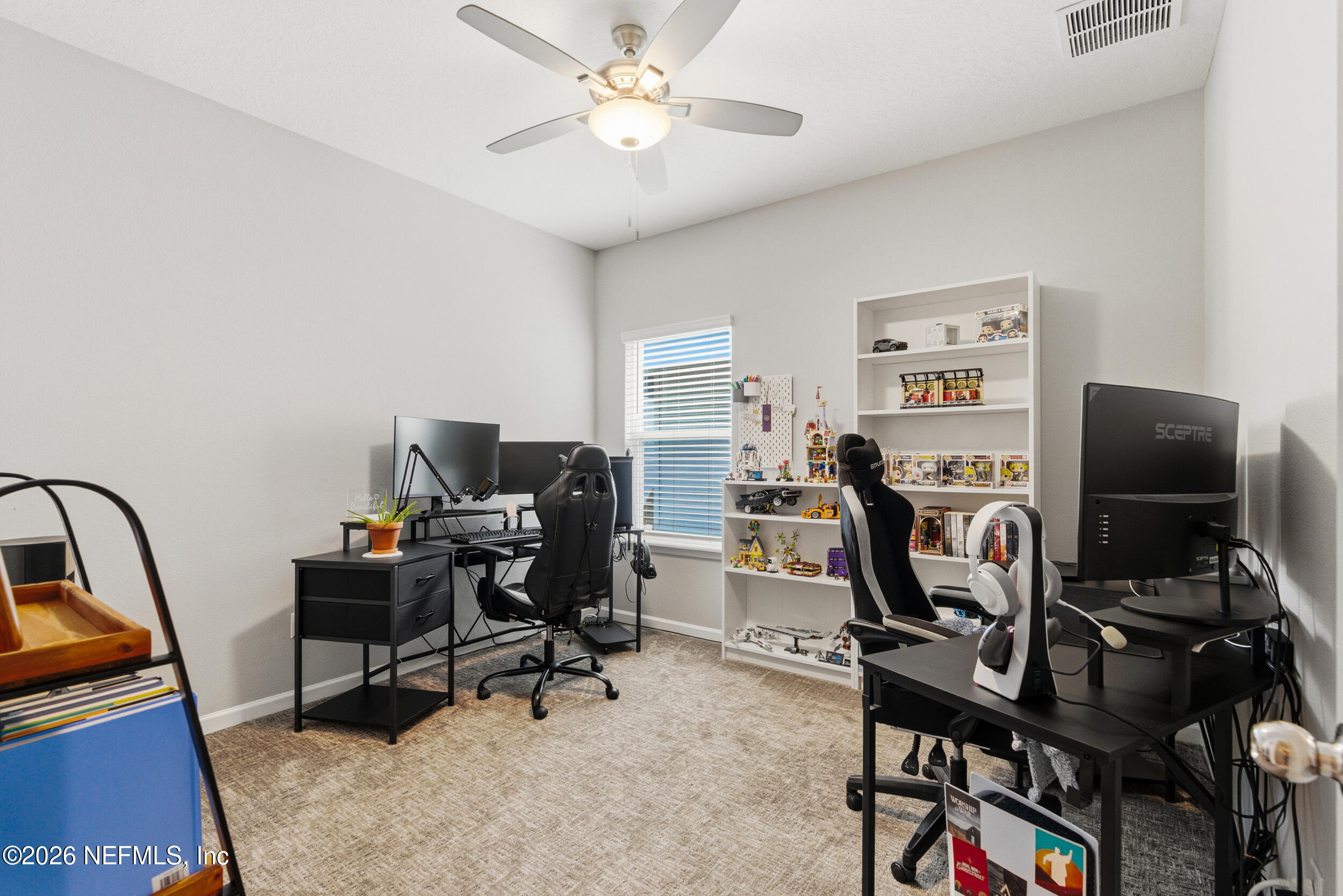 6507 Longleaf Branch Drive Jacksonville, FL 32222 - Photo 25 of 34 a view of a workspace with furniture and a window