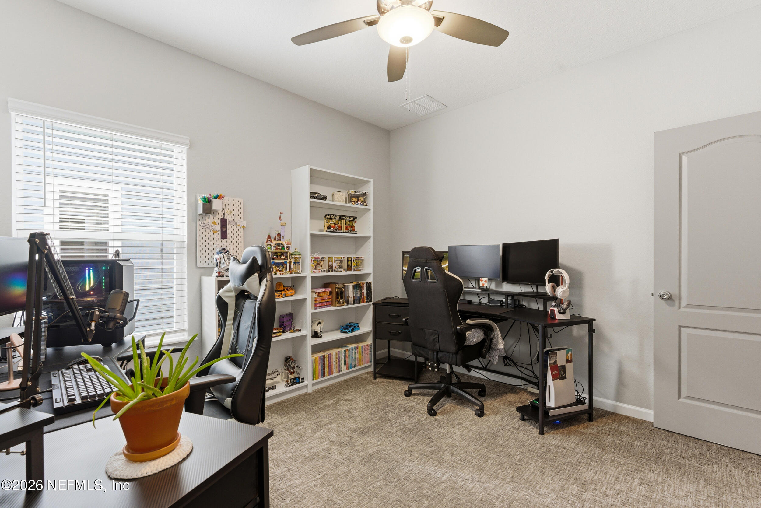 6507 Longleaf Branch Drive Jacksonville, FL 32222 - Photo 26 of 34 a view of a workspace with furniture and a window