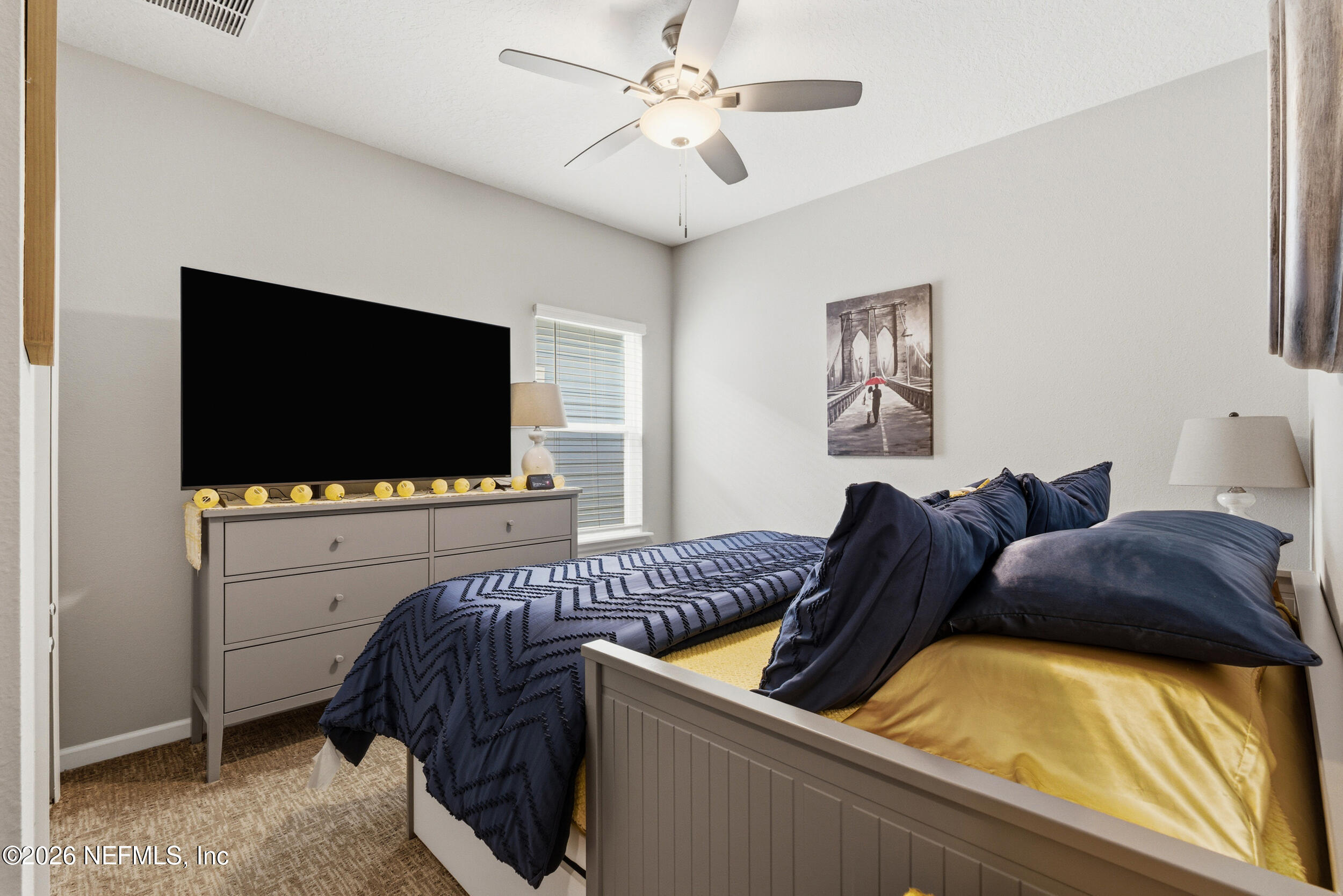 6507 Longleaf Branch Drive Jacksonville, FL 32222 - Photo 28 of 34 a living room with furniture and a flat screen tv