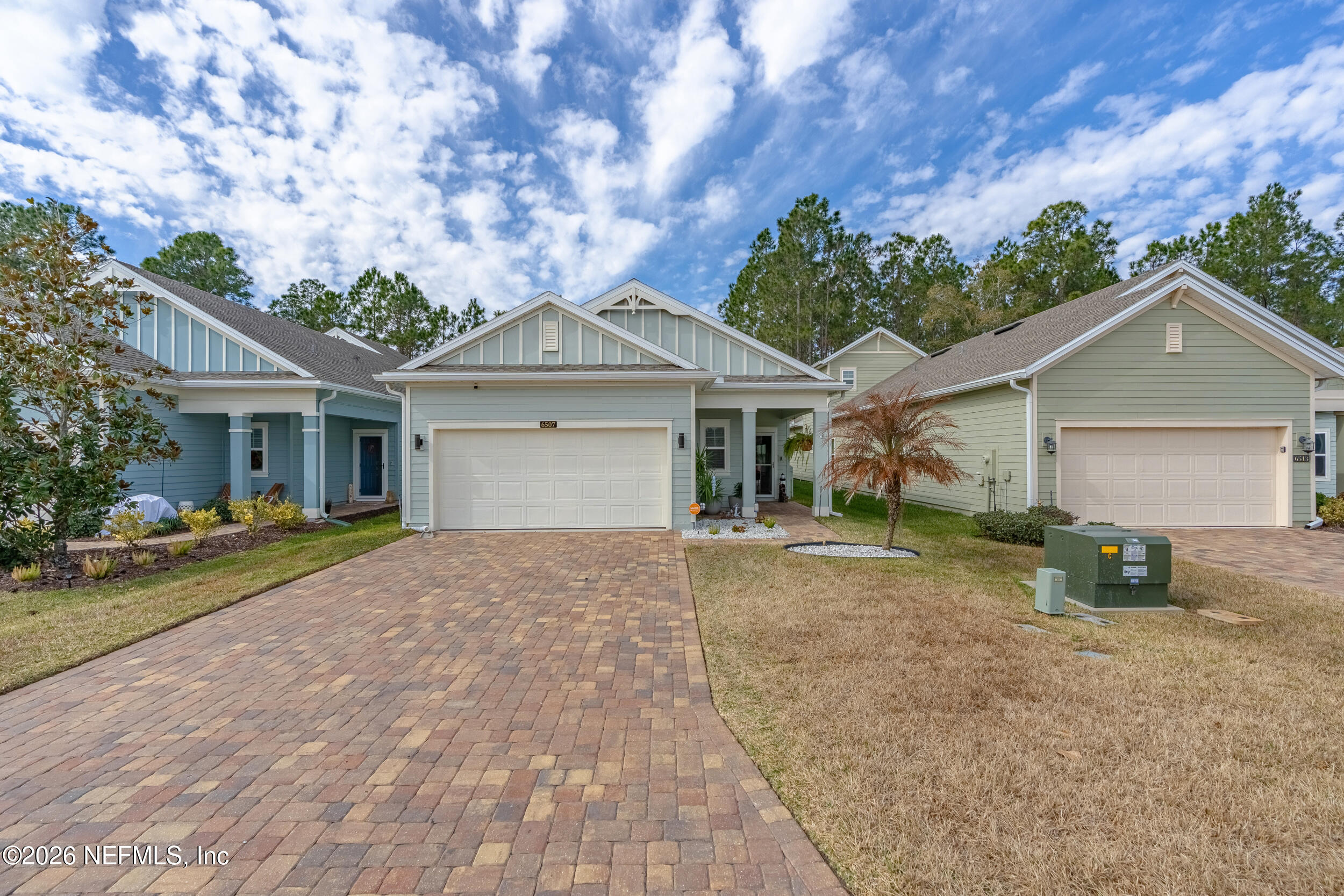 6507 Longleaf Branch Drive Jacksonville, FL 32222 - Photo 4 of 34 a front view of a house with a yard and a garage