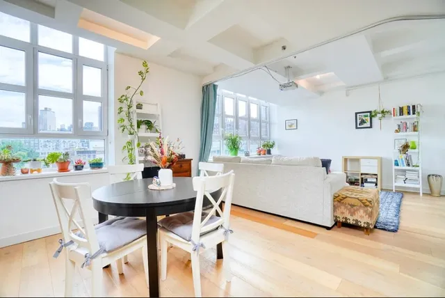 a living room with furniture and a table