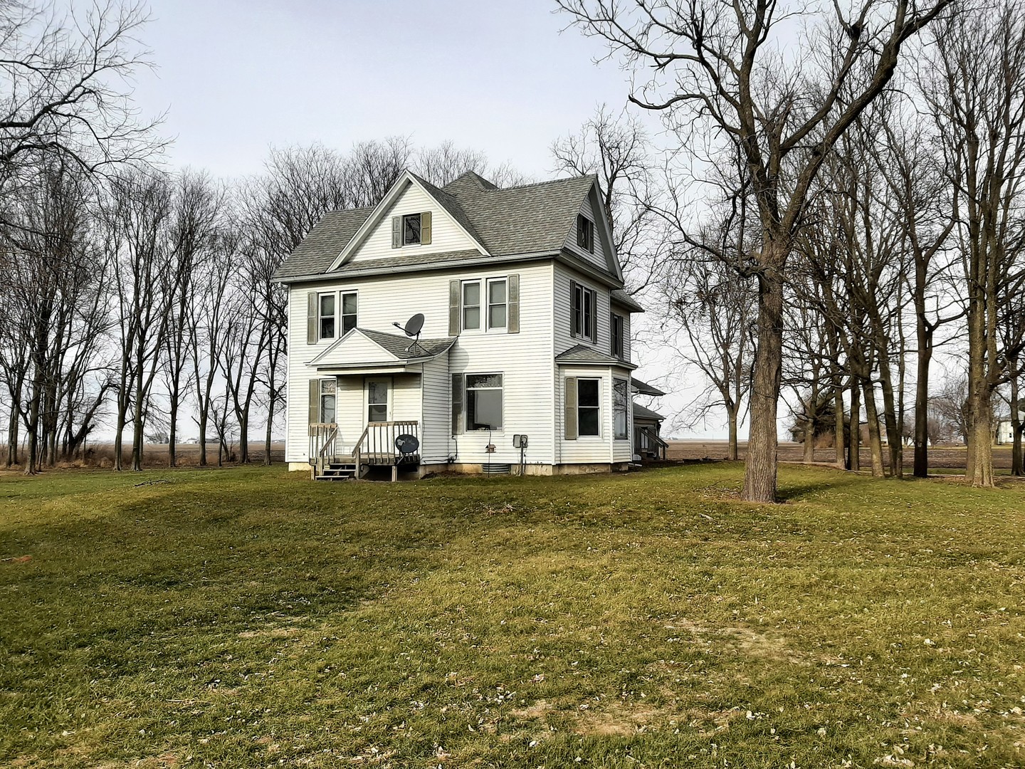 1449 Town Line Road Steward, IL 60553 - Photo 3 of 32 a view of a big house with a big yard and large trees