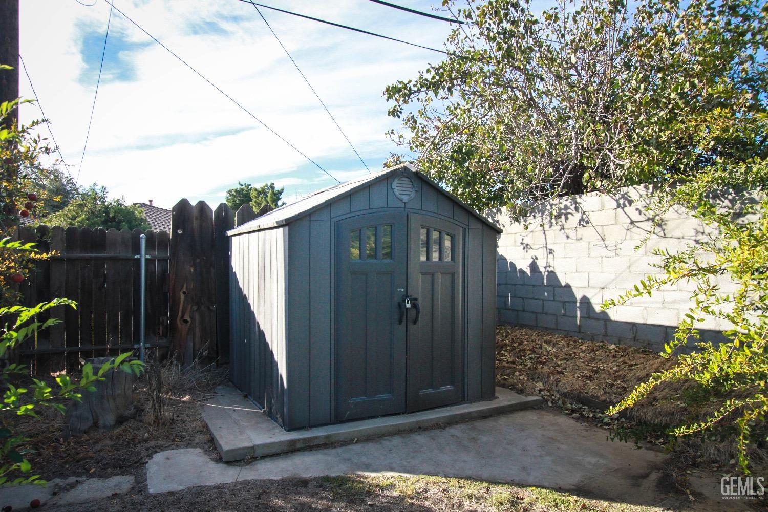 Undisclosed Address Bakersfield, CA 93306 - Photo 18 of 19 a brick house with a tree in the background