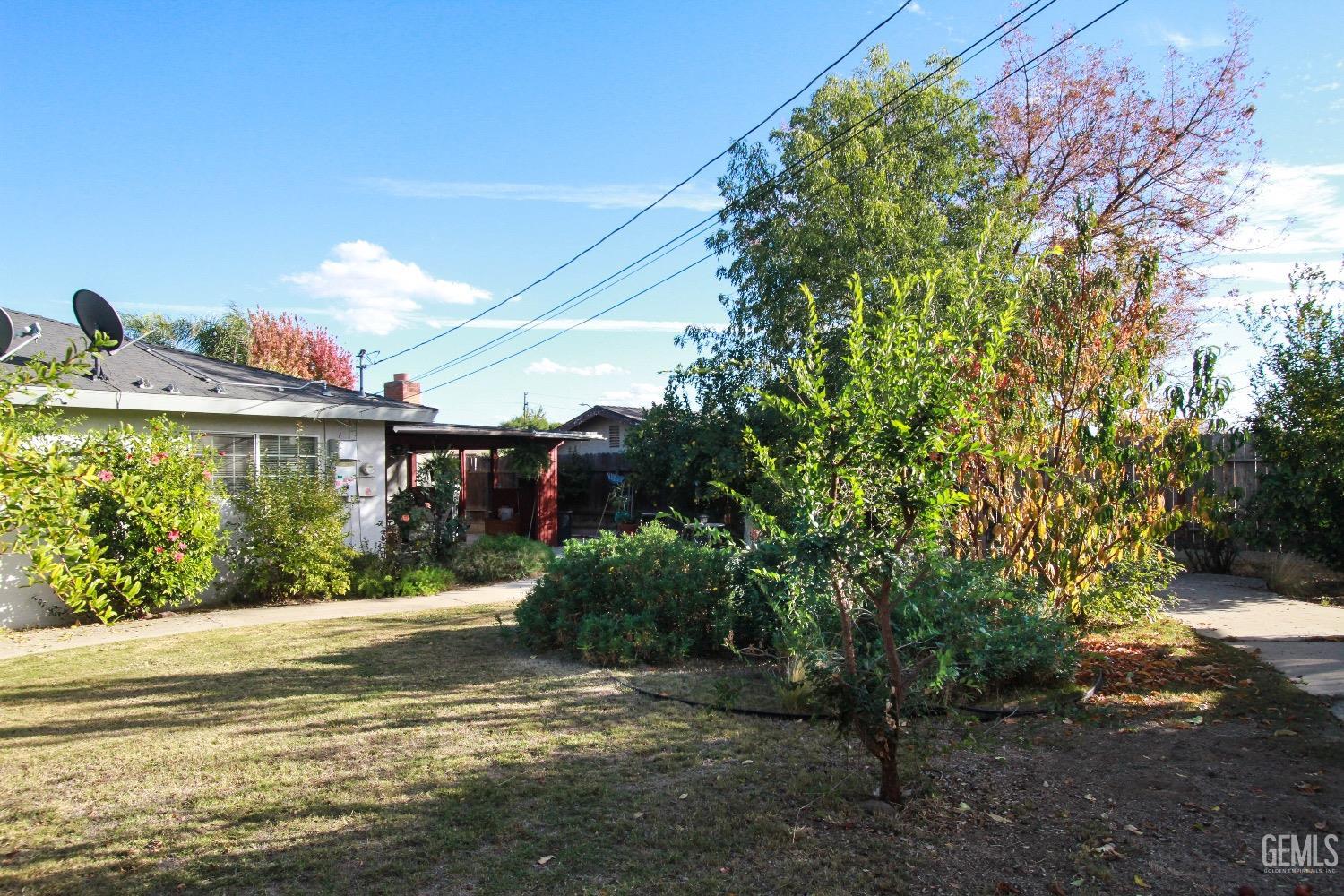 Undisclosed Address Bakersfield, CA 93306 - Photo 19 of 19 a view of a house with a yard