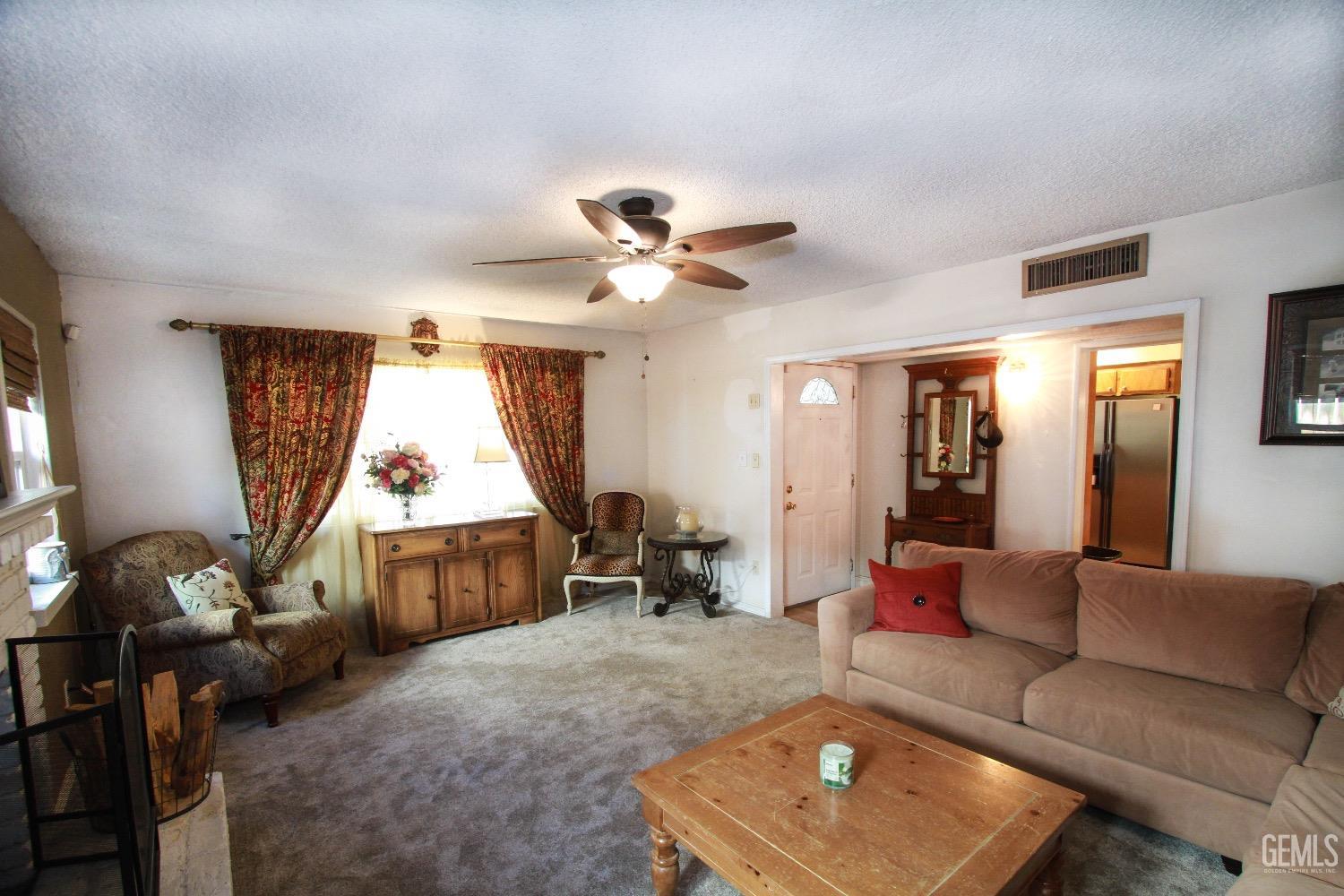 Undisclosed Address Bakersfield, CA 93306 - Photo 5 of 19 a living room with furniture and a window