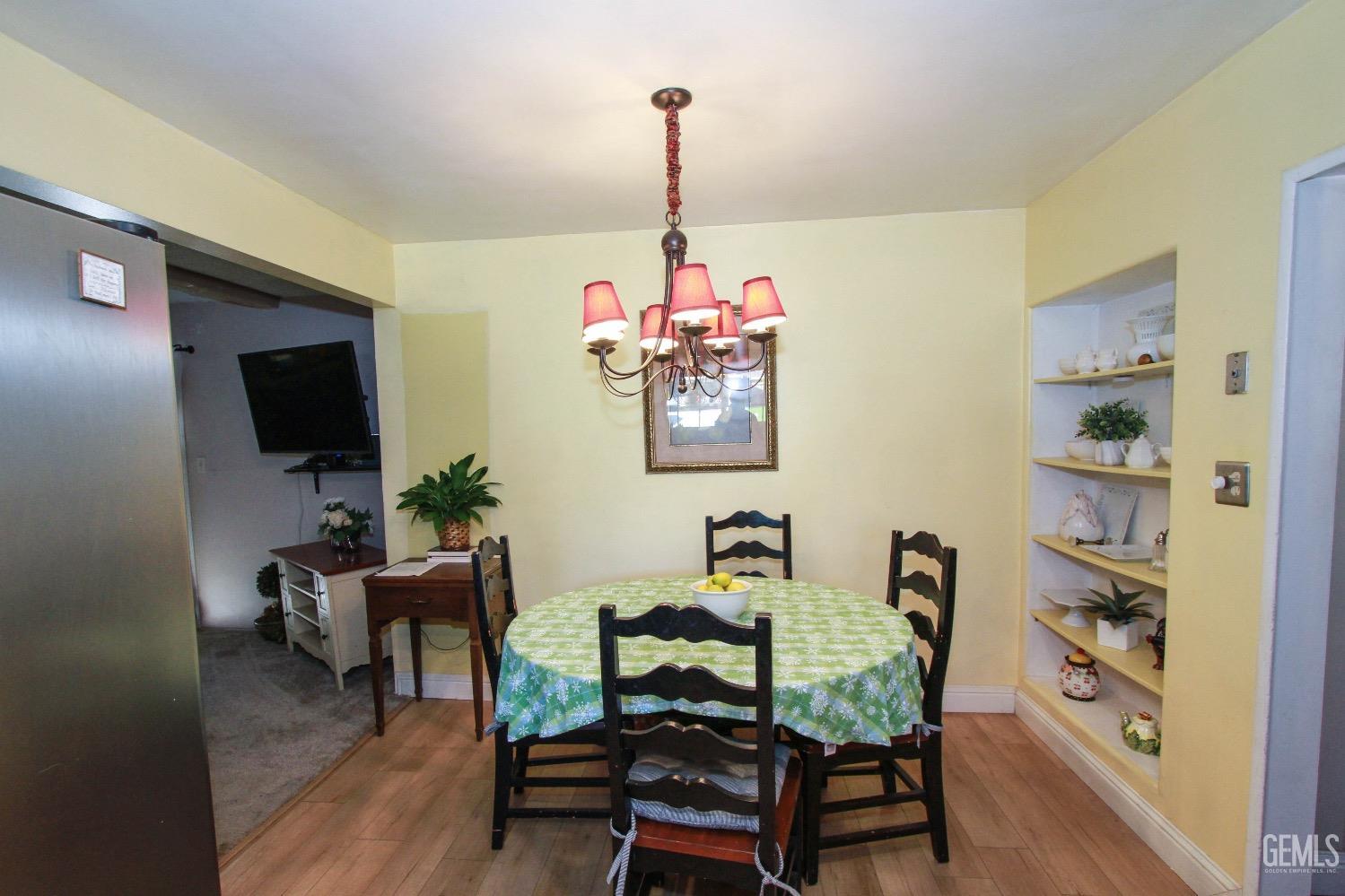 Undisclosed Address Bakersfield, CA 93306 - Photo 9 of 19 a living room with furniture and a flat screen tv