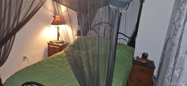 a view of the house with backyard and trees