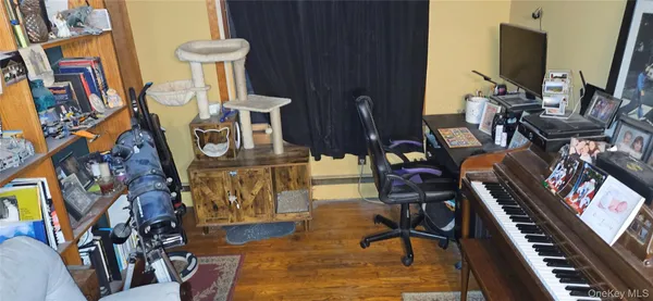 a view of an entryway with wooden floor