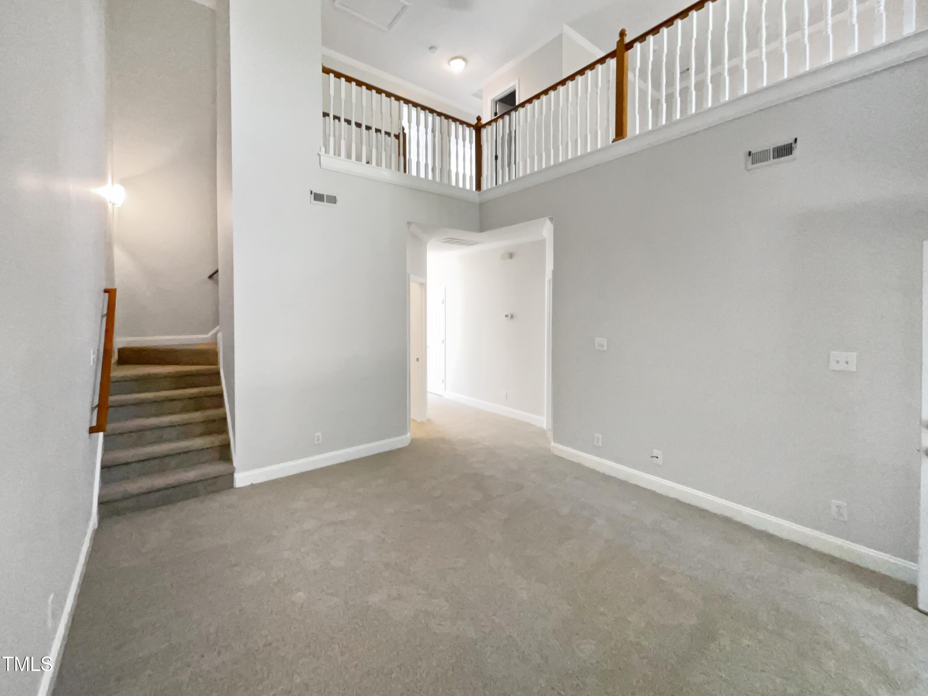 4117 Beaufain Street Raleigh, NC 27604 - Photo 11 of 24 a view of an entryway with staircase