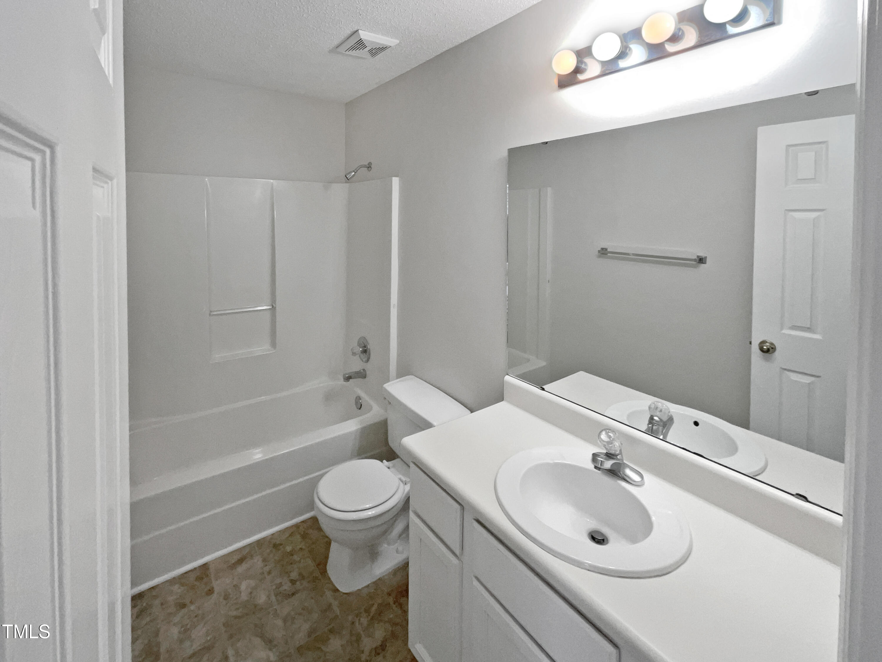 4117 Beaufain Street Raleigh, NC 27604 - Photo 17 of 24 a bathroom with a sink toilet tub and shower