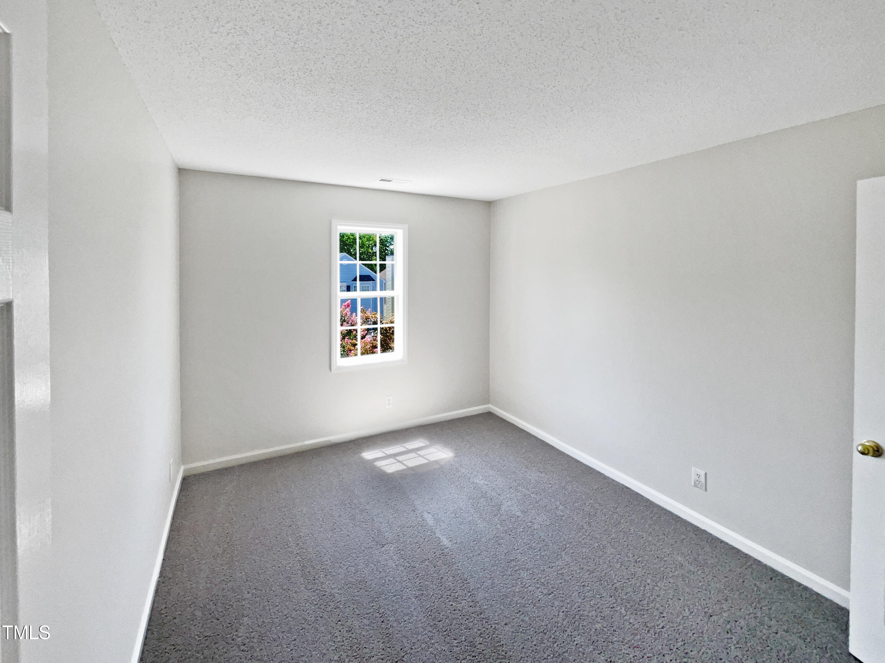 4117 Beaufain Street Raleigh, NC 27604 - Photo 18 of 24 an empty room with windows