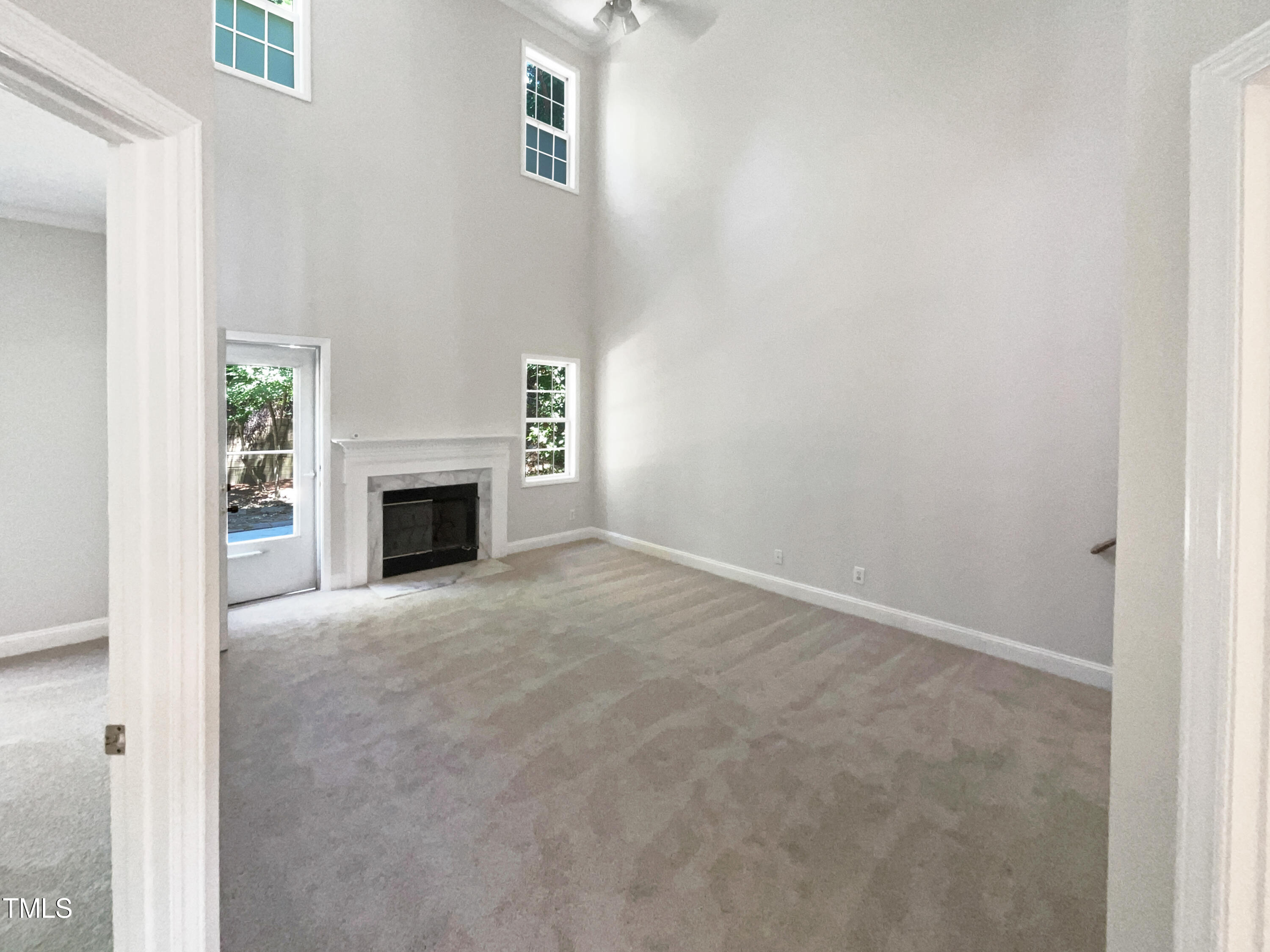 4117 Beaufain Street Raleigh, NC 27604 - Photo 4 of 24 a view of empty room with a fireplace