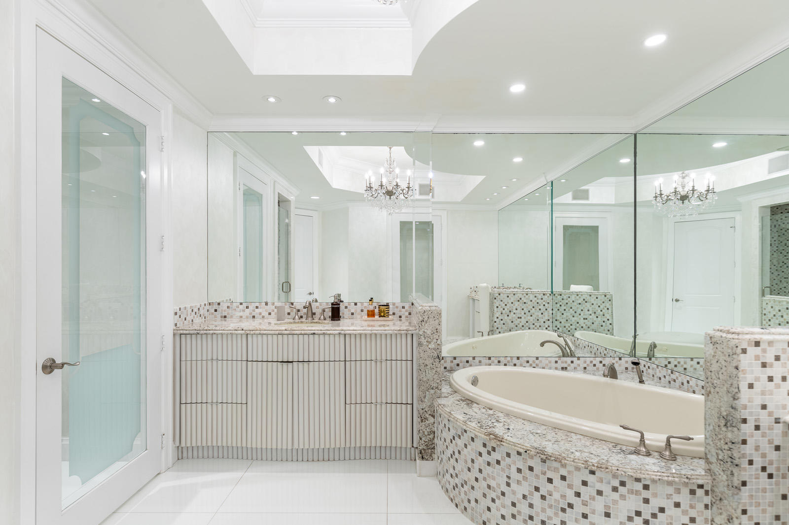 1 North Ocean Boulevard, Unit 305 Boca Raton, FL 33432 - Photo 15 of 27 a large spacious bathroom with a double vanity sink mirror and a bathtub