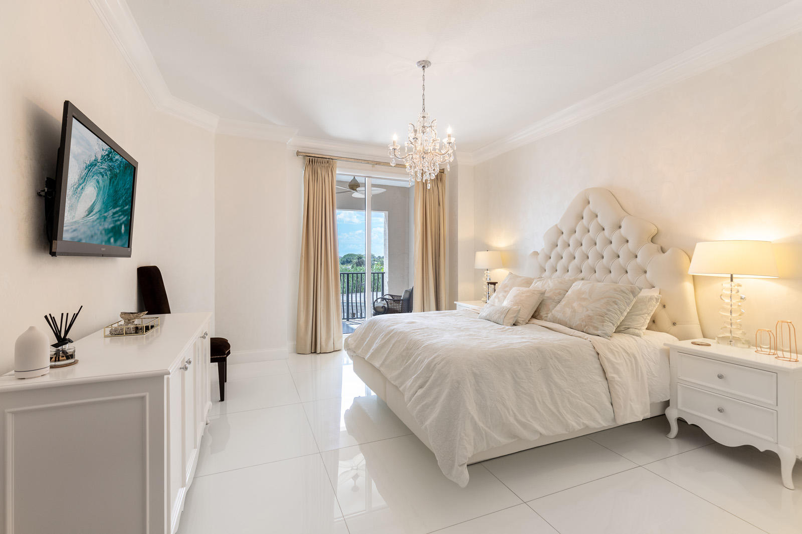 1 North Ocean Boulevard, Unit 305 Boca Raton, FL 33432 - Photo 18 of 27 a bedroom with a bed and a flat screen tv