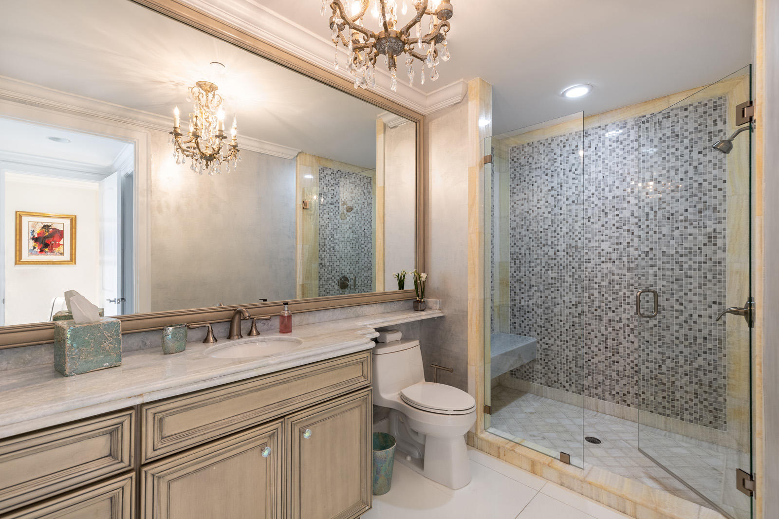 1 North Ocean Boulevard, Unit 305 Boca Raton, FL 33432 - Photo 19 of 27 a bathroom with a granite countertop sink a toilet a mirror and shower