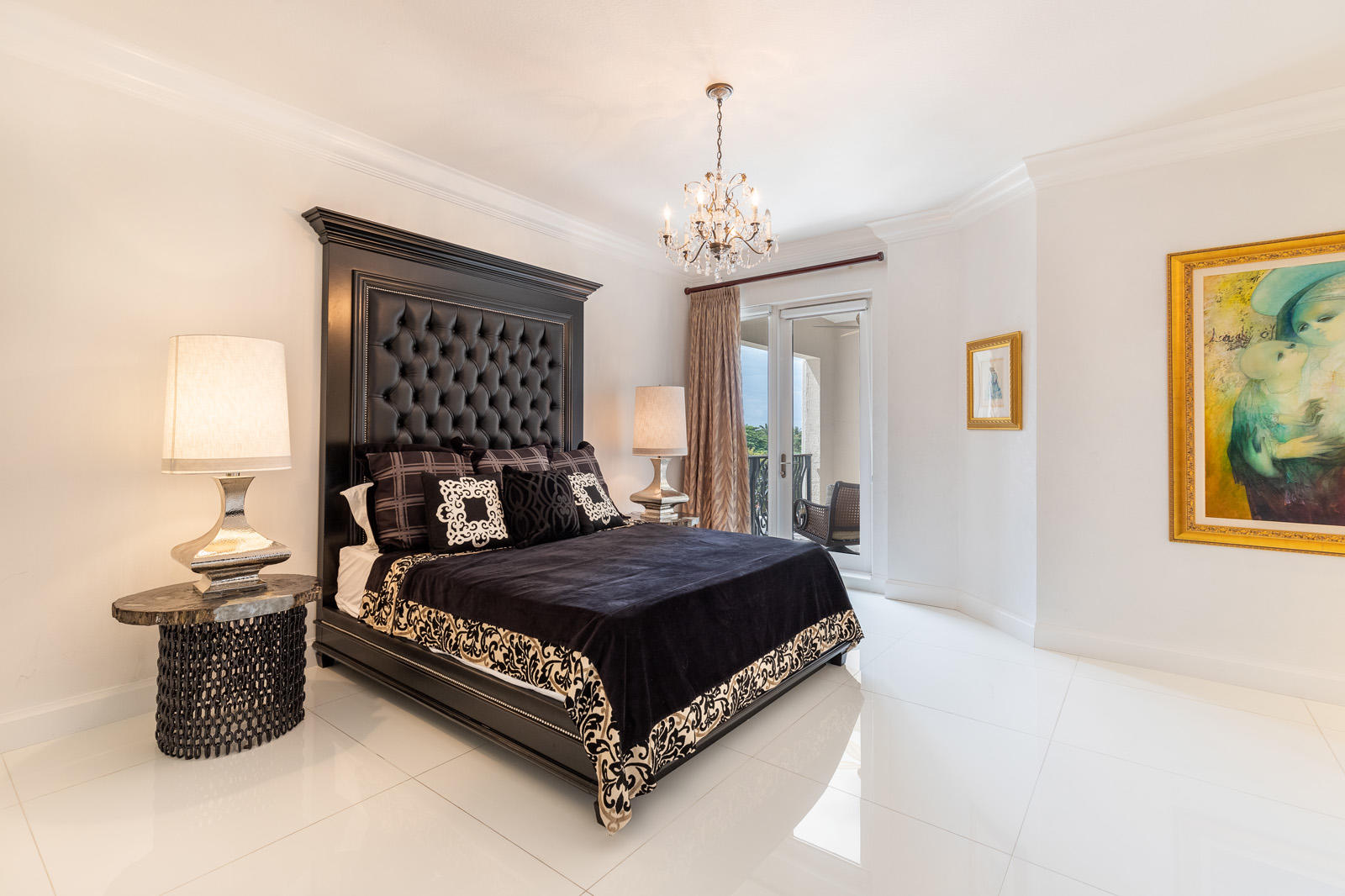 1 North Ocean Boulevard, Unit 305 Boca Raton, FL 33432 - Photo 21 of 27 a bedroom with a bed chandelier and window