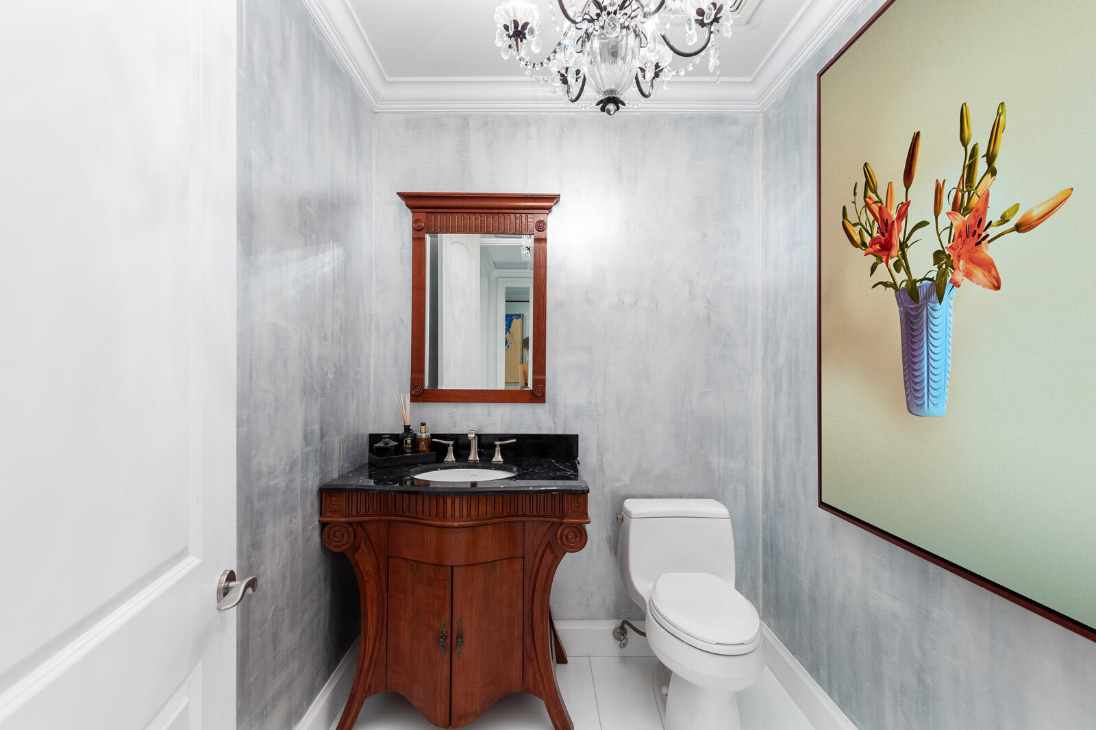 1 North Ocean Boulevard, Unit 305 Boca Raton, FL 33432 - Photo 23 of 27 a bathroom with a toilet a sink and mirror