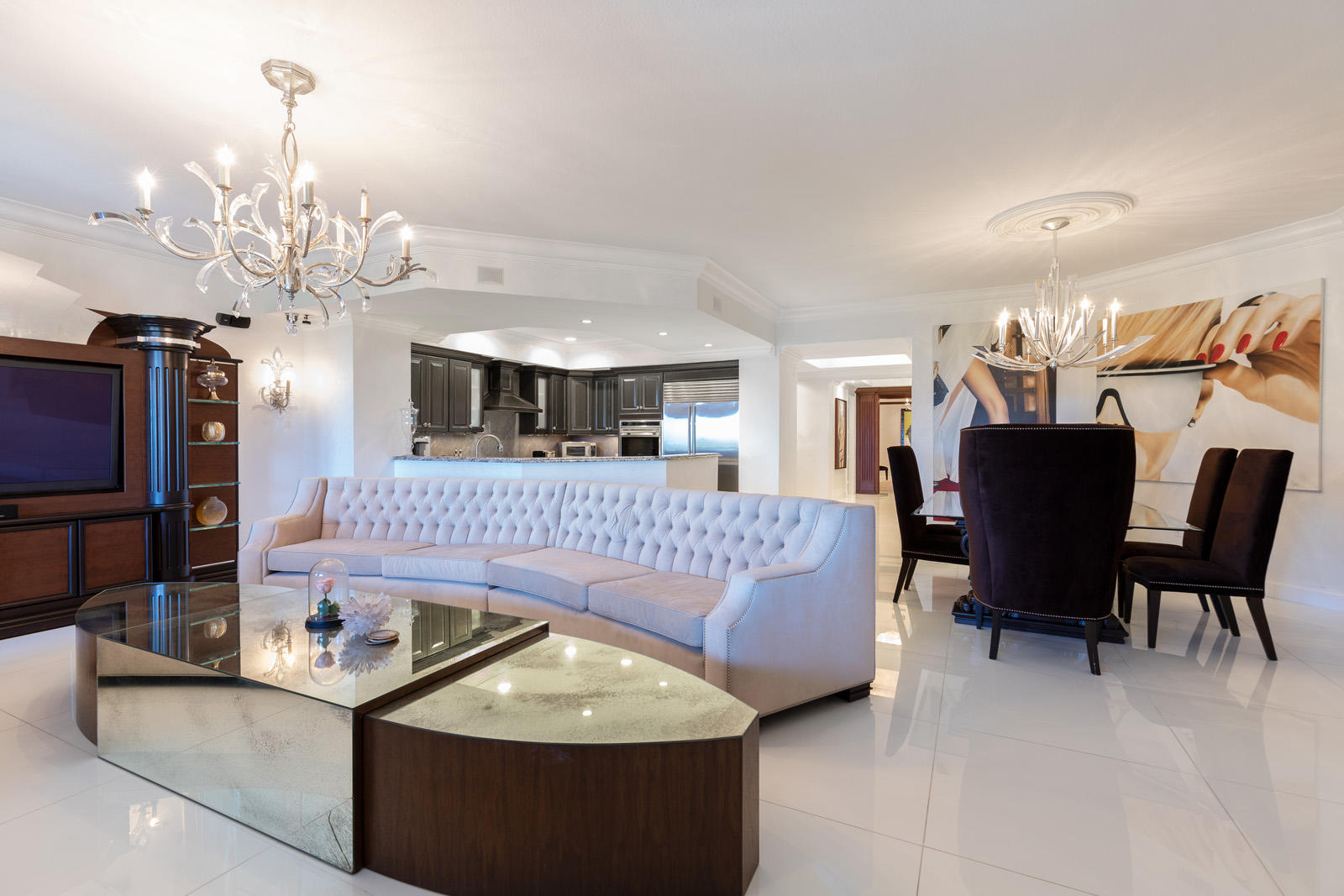 1 North Ocean Boulevard, Unit 305 Boca Raton, FL 33432 - Photo 4 of 27 a living room with furniture and a chandelier