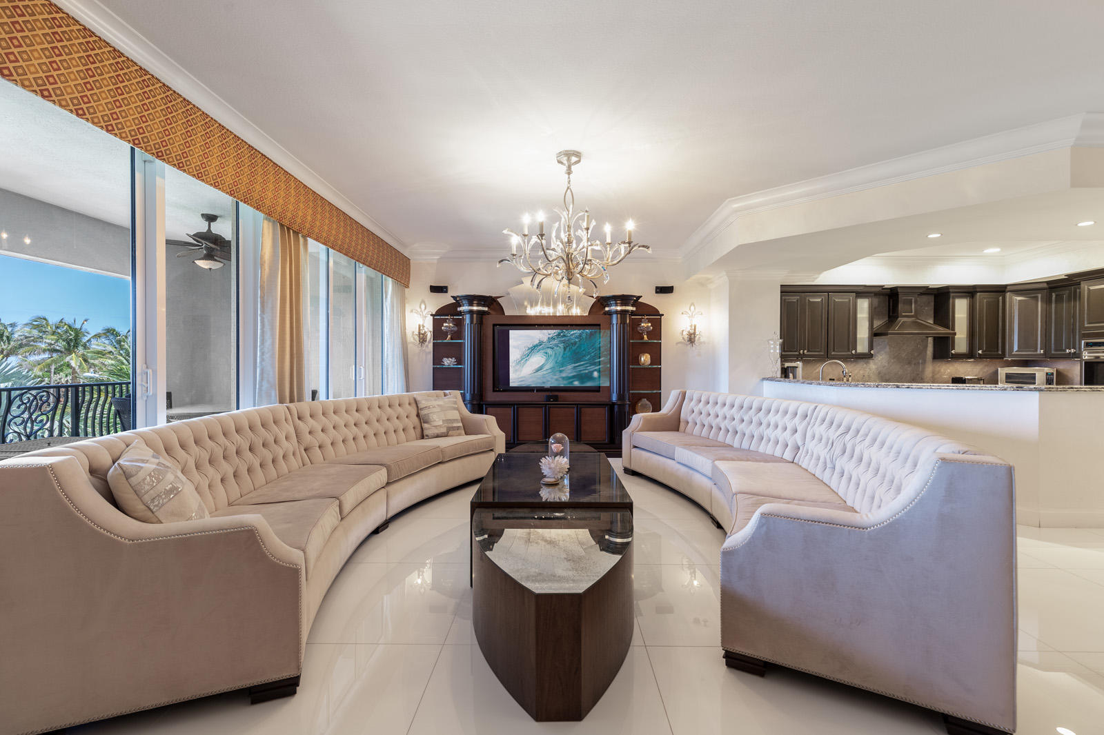 1 North Ocean Boulevard, Unit 305 Boca Raton, FL 33432 - Photo 5 of 27 a living room with furniture and a chandelier