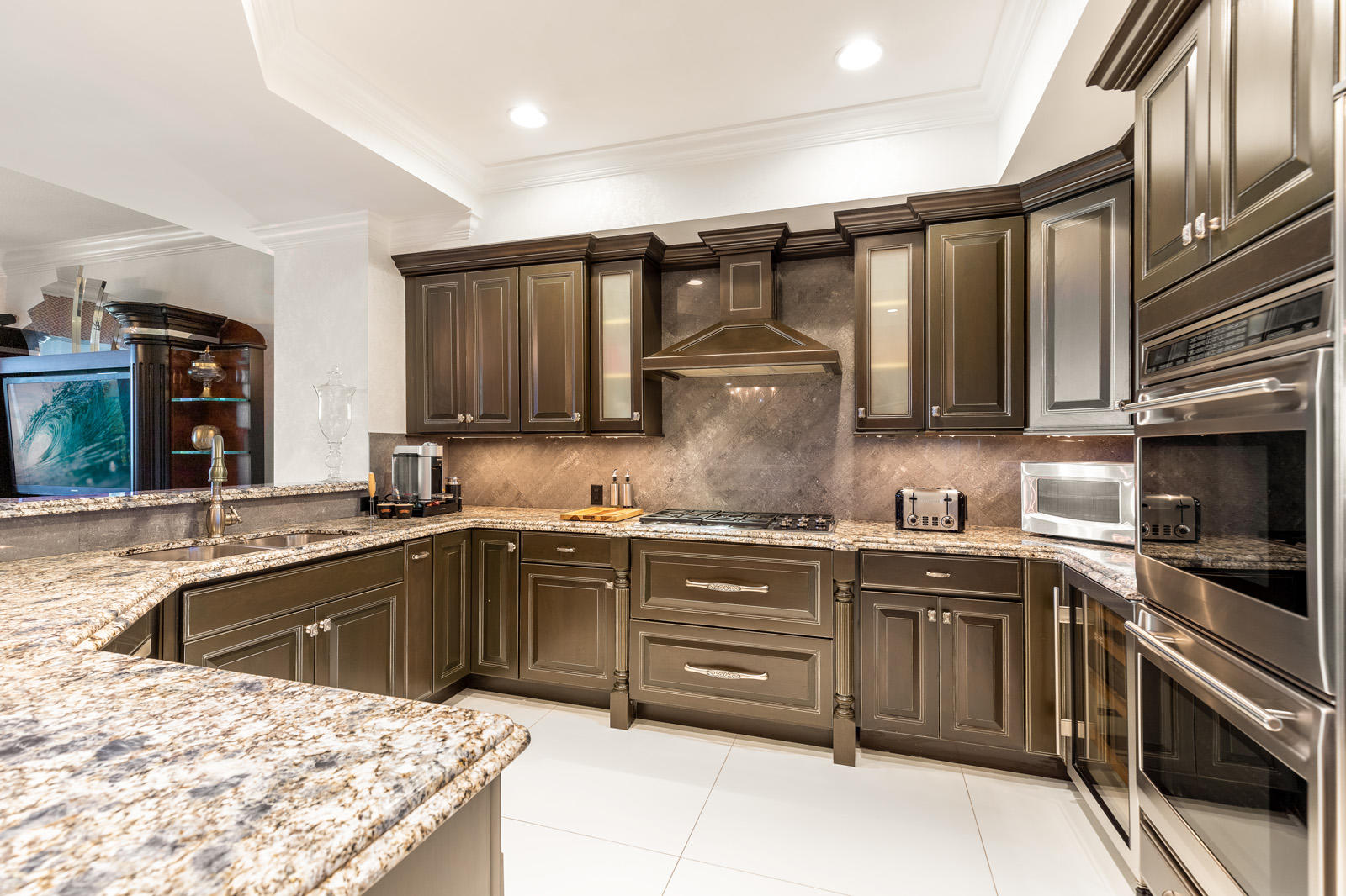 1 North Ocean Boulevard, Unit 305 Boca Raton, FL 33432 - Photo 7 of 27 a kitchen with stainless steel appliances granite countertop a sink and stove top oven
