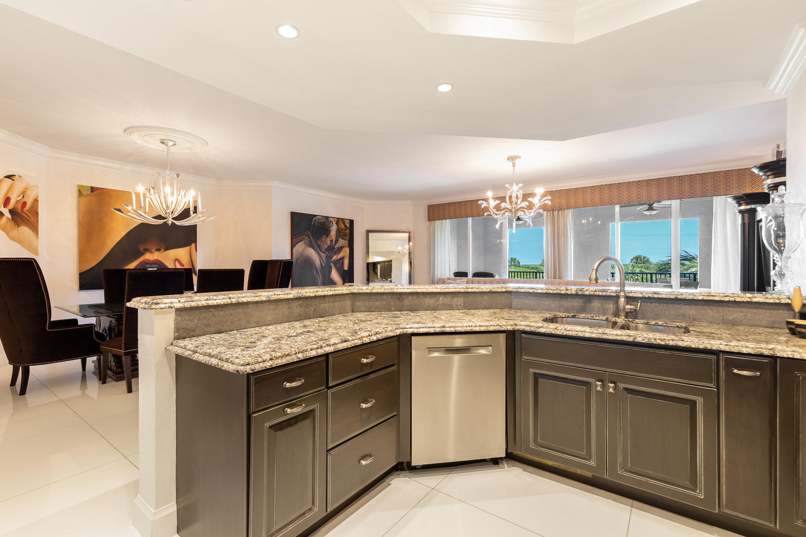 1 North Ocean Boulevard, Unit 305 Boca Raton, FL 33432 - Photo 8 of 27 a kitchen with a sink stove and cabinets