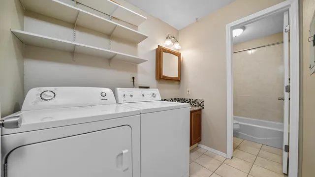 a utility room with dryer and washer