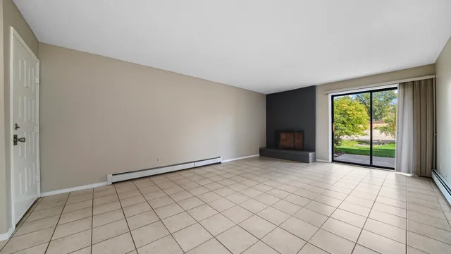 a view of an empty room and window