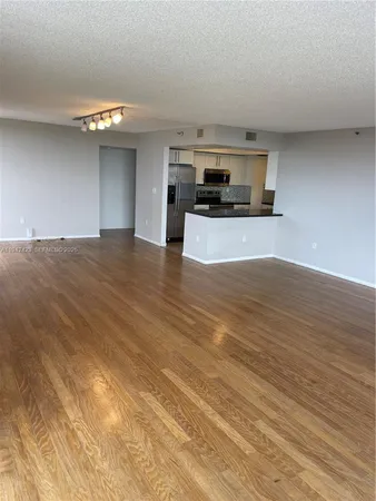 a view of kitchen with cabinets