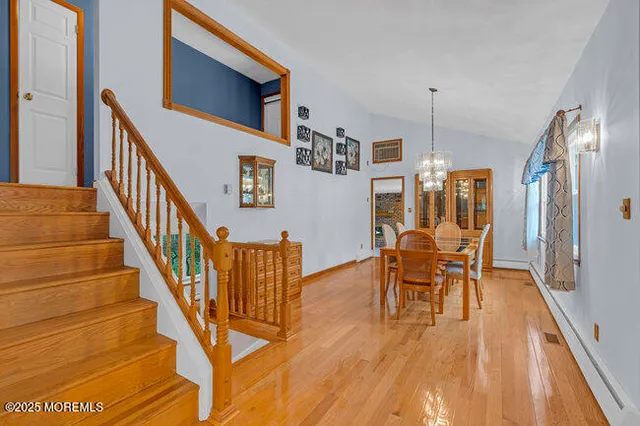 a view of dining room with furniture and wooden floor