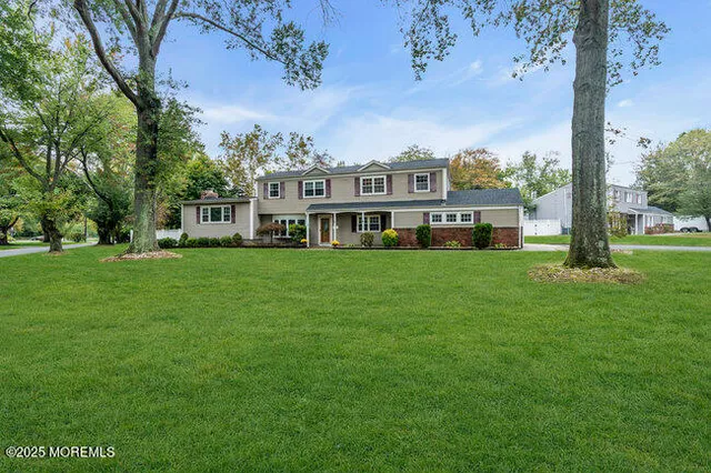 a view of a house with a big yard