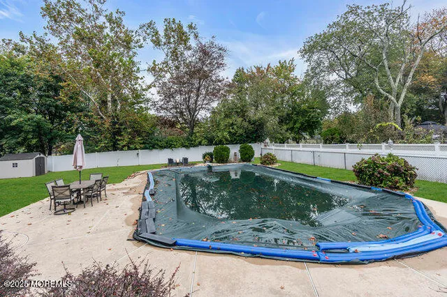 a view of a swimming pool with a sitting area