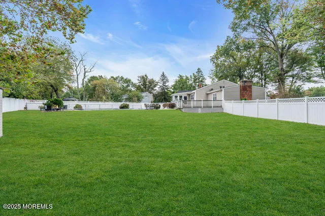 a view of a house with a big yard