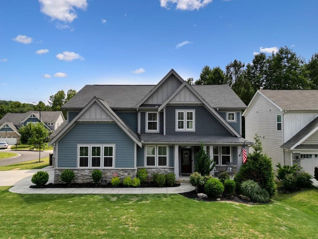 a front view of a house with a yard and garage