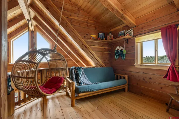 a couch sitting in a room next to a window