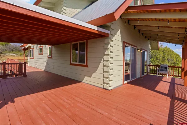 a view of a patio with wooden floor