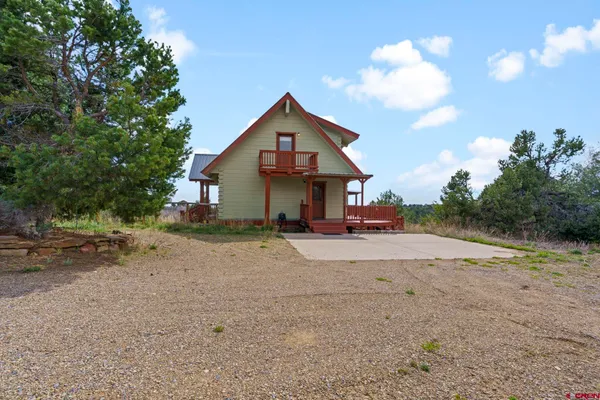 a front view of a house with a yard and pathway