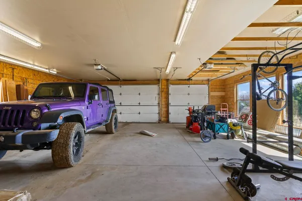 a view of a garage with parked cars